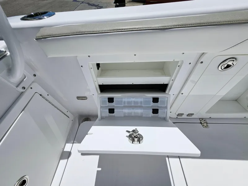 Slide: The Image of 2022 Century 2900 Center Console boat storage compartments and seating area. - 17