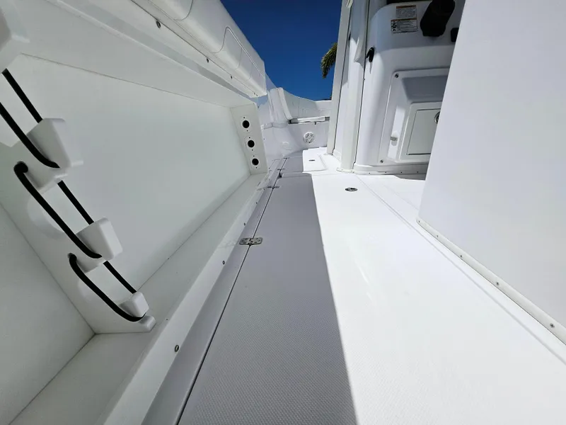 Slide: The Image of 2022 Century 2900 Center Console boat interior, showcasing sleek white design and spacious layout. - 18