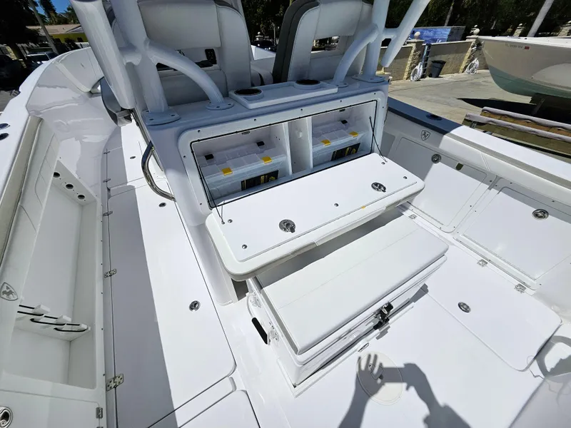 Slide: The Image of 2022 Century 2900 Center Console boat interior with seating and storage compartments. - 21