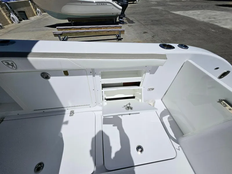 Slide: The Image of 2022 Century 2900 Center Console boat interior with open storage compartments. - 23