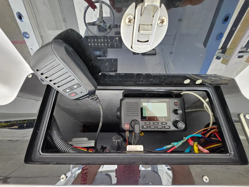 Slide: The Image of 2022 Century 2900 Center Console communication equipment with radio and wiring. - 25