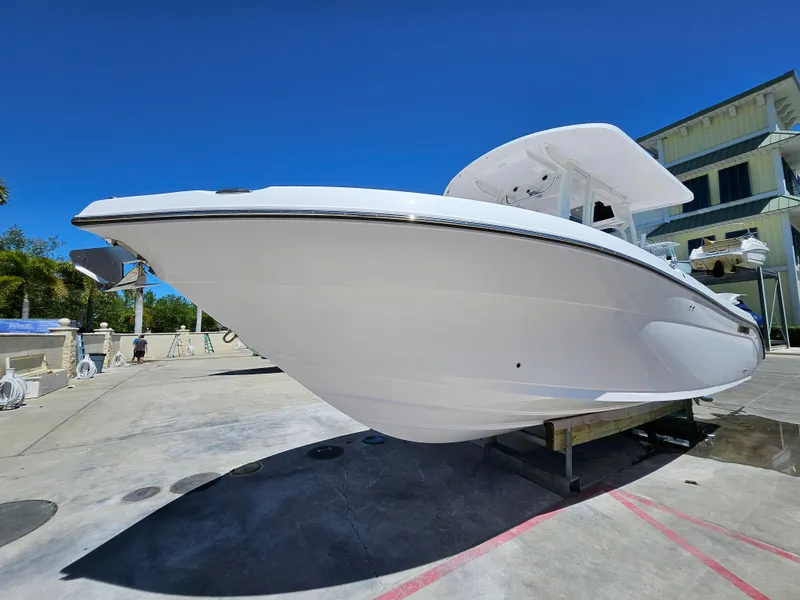 Slide: The Image of 2022 Century 2900 Center Console boat on display outdoors. - 4