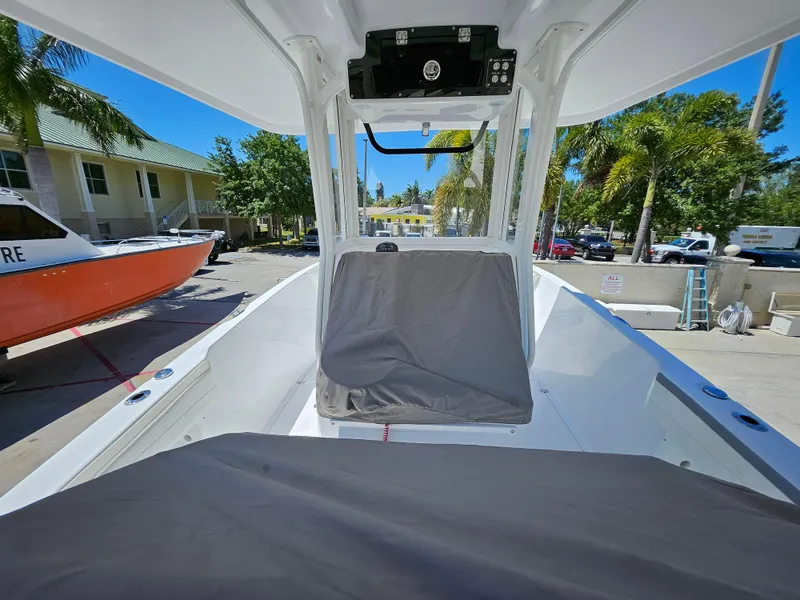 Slide: The Image of 2022 Century 2900 Center Console boat in a sunny marina setting. - 40