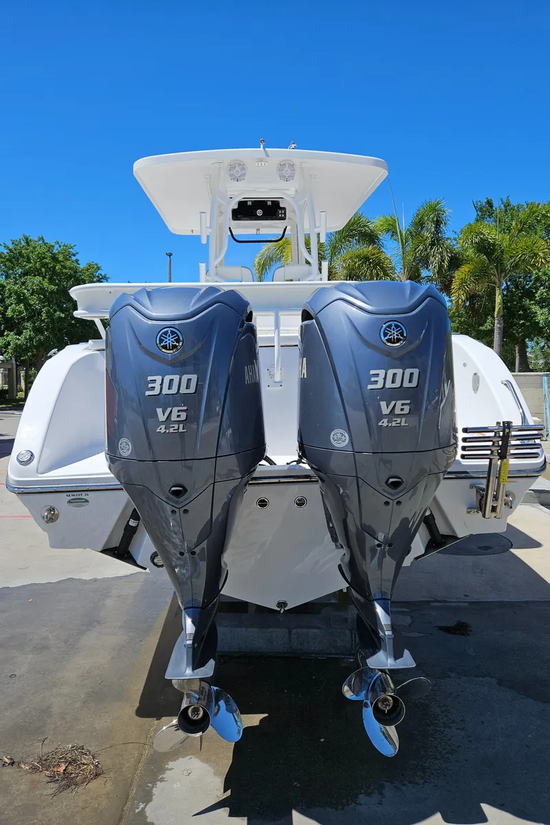 Slide: The Image of 2022 Century 2900 Center Console with twin 300 V6 outboard engines, rear view. - 42