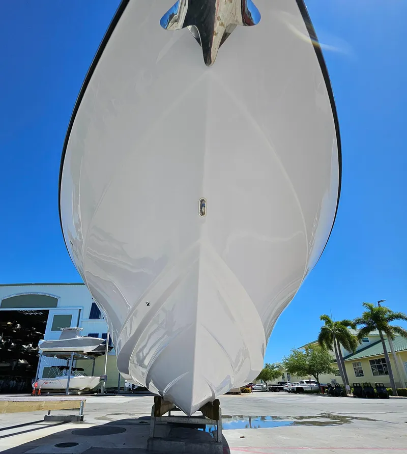 Slide: The Image of 2022 Century 2900 Center Console boat, docked, under clear blue sky. - 46