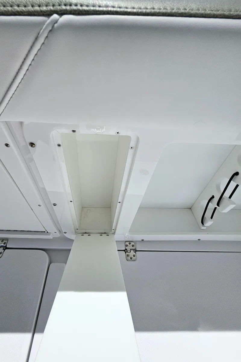 Slide: The Image of 2022 Century 2900 Center Console interior ceiling with storage compartments. - 49