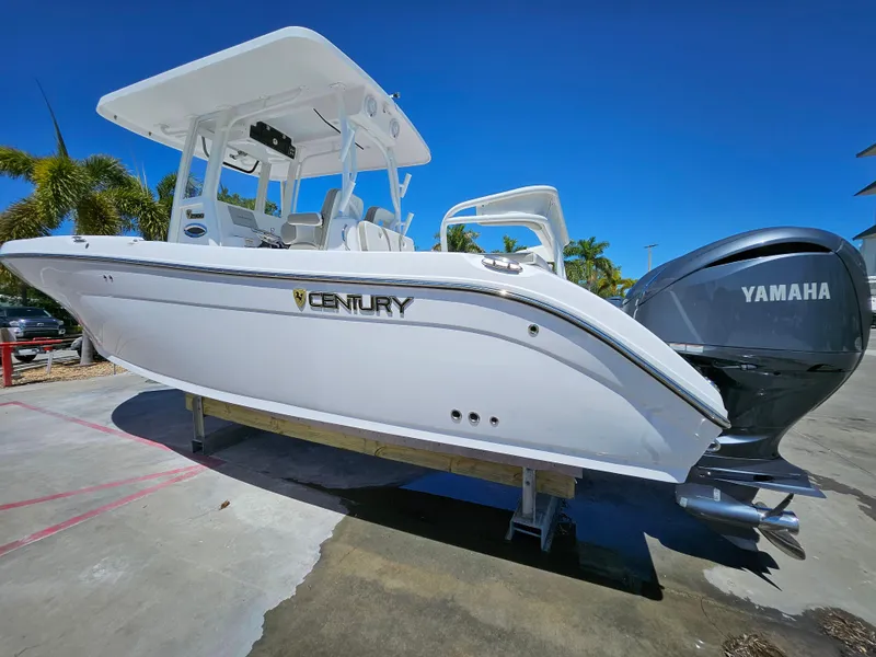Slide: The Image of 2022 Century 2900 Center Console boat with Yamaha engine, displayed outdoors. - 6