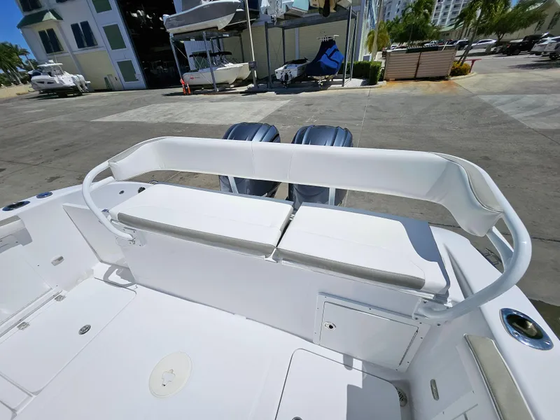 Slide: The Image of 2022 Century 2900 Center Console boat with dual engines, docked at a marina. - 8