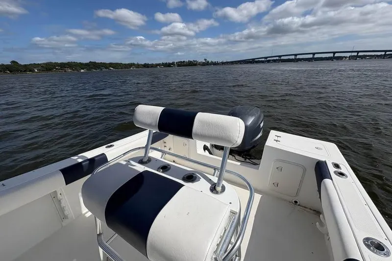 Slide: The Image of Edgewater 225CC boat from 2001 on water, with bridge and cloudy sky in background. - 13