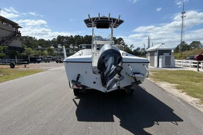 Slide: The Image of 2001 Edgewater 225CC boat with outboard motor on a sunny day. - 3