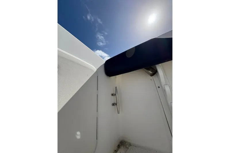 Slide: The Image of 2001 Edgewater 225CC boat interior with sunlight and clear sky. - 7