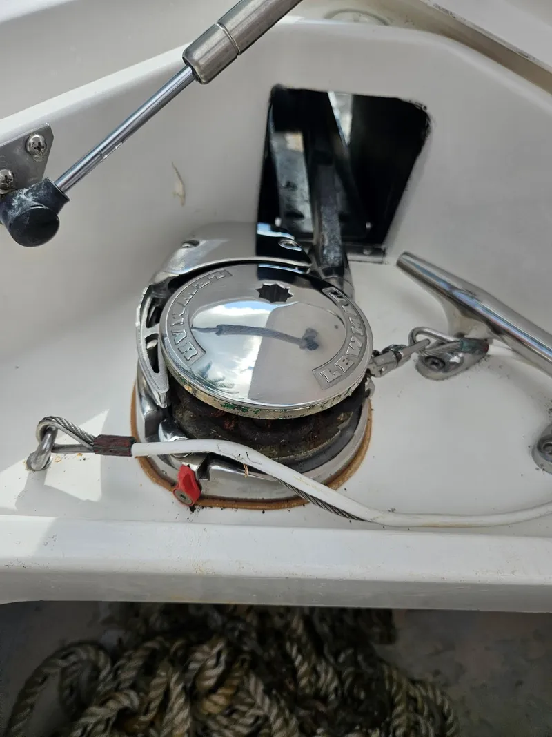 Slide: The Image of Anchor winch on 2005 Intrepid 323 Cuddy boat, featuring ropes and metal components. - 21