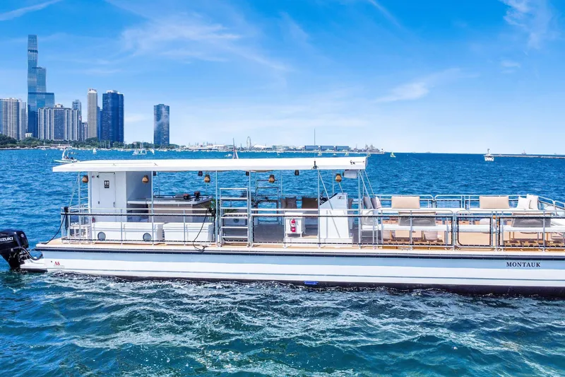 Slide: The Image of A&M Manufacturing 2026 COI boat on water with city skyline background. - 2