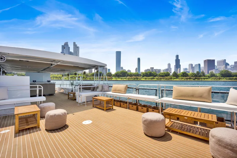 Slide: The Image of Luxurious A&M Manufacturing COI 2026 yacht deck with city skyline view. - 4