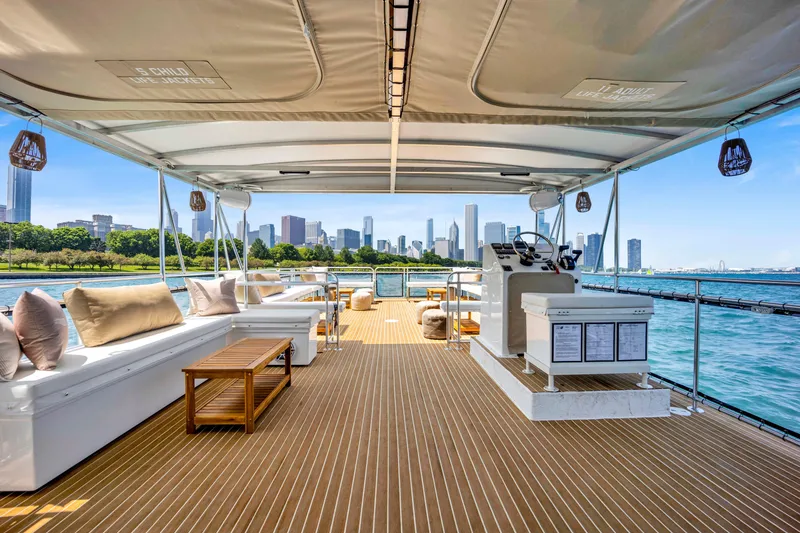 Slide: The Image of Luxurious 2026 A&M Manufacturing COI yacht deck with city skyline view. - 5