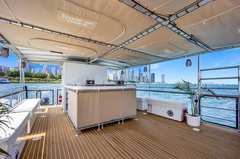 Slide: The Image of Luxurious 2026 A&M Manufacturing COI boat deck with city skyline and waterfront views. - 7