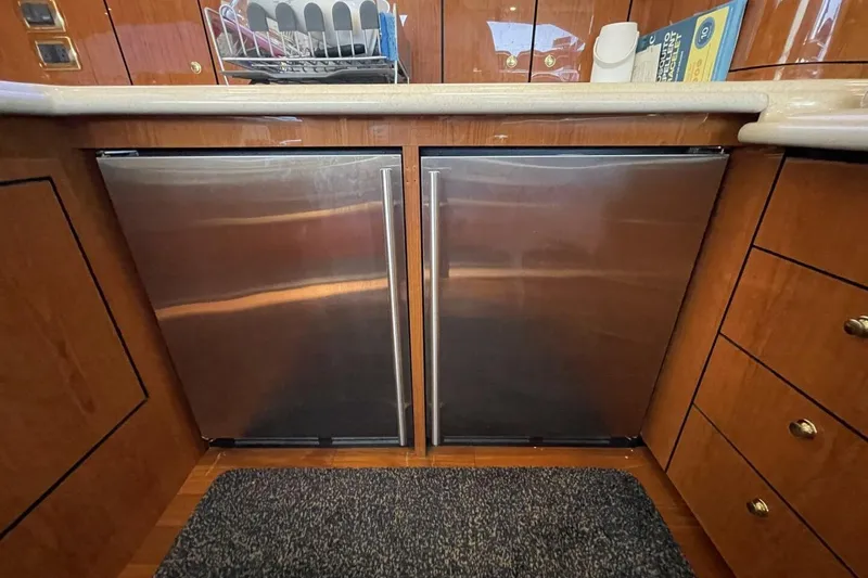 Slide: The Image of Luxurious interior of 2001 Sea Ray 560 Sedan Bridge with plush seating and modern amenities. - 19