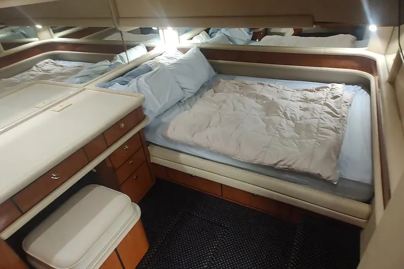 Slide: The Image of Luxurious interior of 2001 Sea Ray 560 Sedan Bridge with plush leather seating. - 20