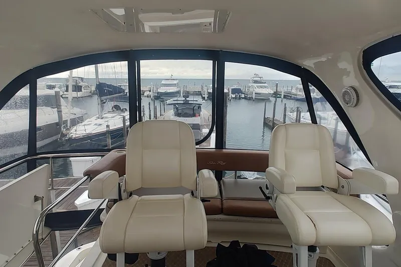 Slide: The Image of Bathroom interior of 2001 Sea Ray 560 Sedan Bridge yacht, featuring shower and toilet. - 30