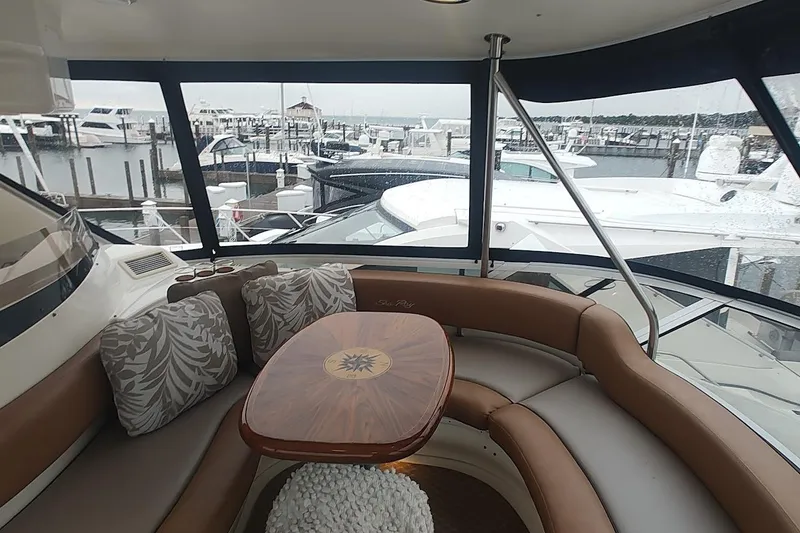 Slide: The Image of Control panel of a 2001 Sea Ray 560 Sedan Bridge yacht, featuring navigation and communication equipment. - 40