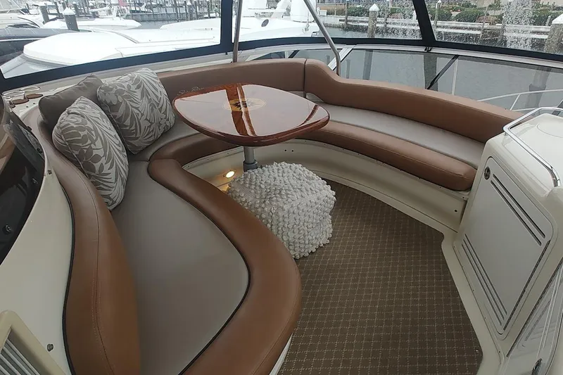 Slide: The Image of Cockpit of 2001 Sea Ray 560 Sedan Bridge with navigation screens and controls. - 41