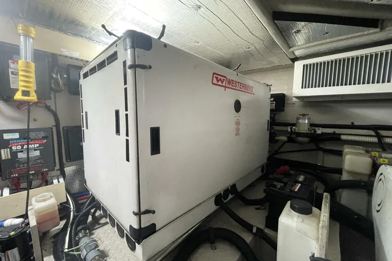 Slide: The Image of Luxurious seating area on 2001 Sea Ray 560 Sedan Bridge yacht with elegant cushions and table. - 46