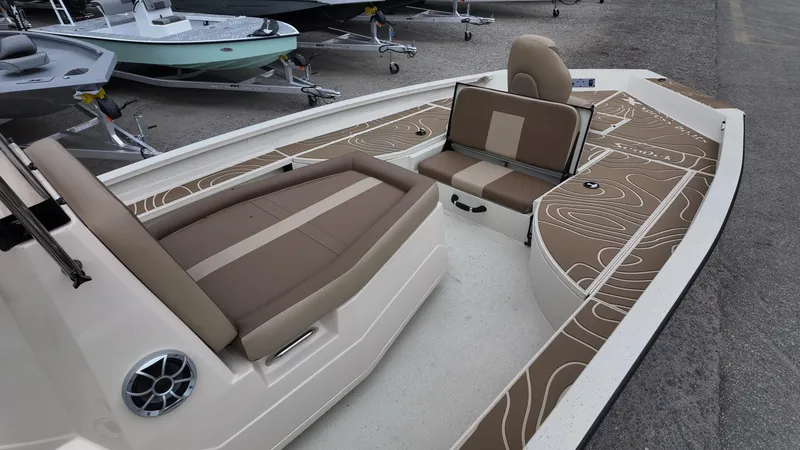 Slide: The Image of 2025 Xpress X23B Lounge boat interior with stylish seating and modern design. - 12