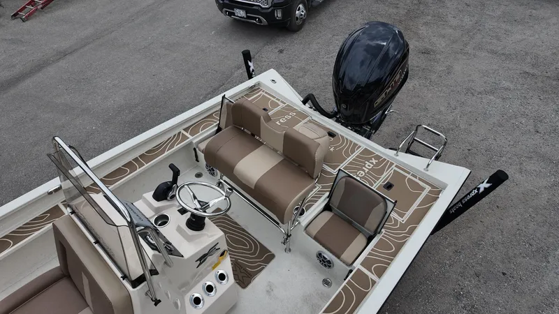 Slide: The Image of 2025 Xpress X23B Lounge boat with seating and steering console, viewed from above. - 19