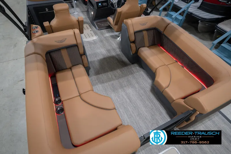 Slide: The Image of Luxurious interior of 2026 Bennington 22 MFB pontoon boat with tan seating and LED lighting. - 15
