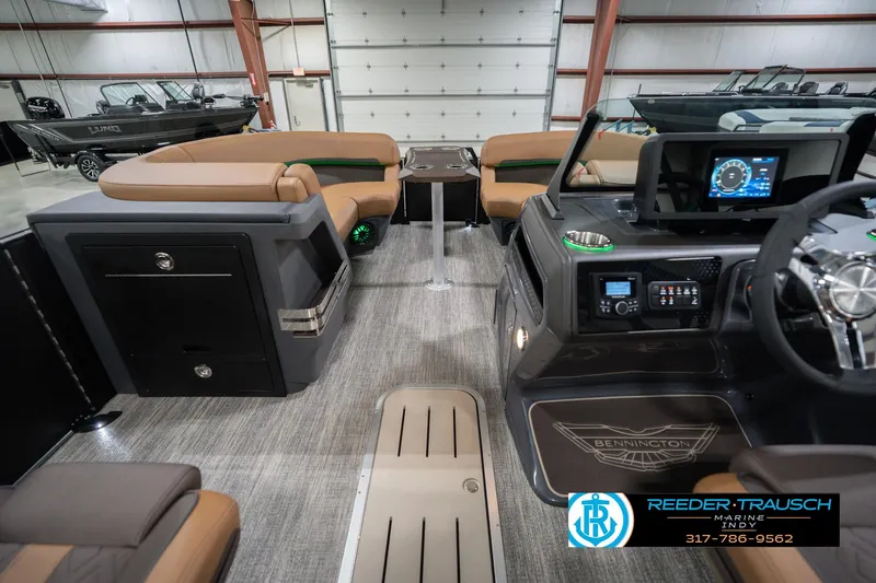 Slide: The Image of 2026 Bennington 22 MFB boat interior with modern dashboard and seating. - 20