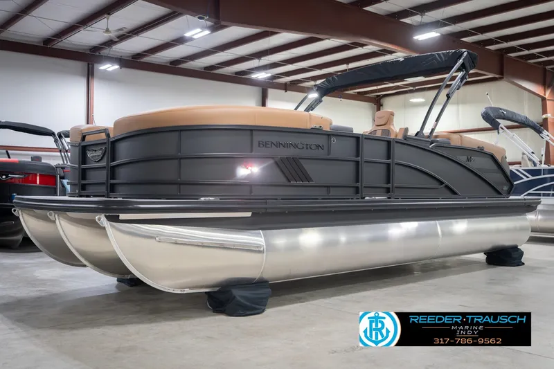 Slide: The Image of 2026 Bennington 22 MFB pontoon boat in showroom, featuring sleek design and modern amenities. - 3
