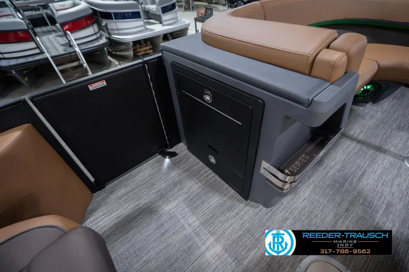 Slide: The Image of Interior of 2026 Bennington 22 MFB boat with brown seating and storage compartment. - 30