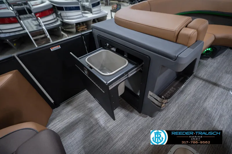 Slide: The Image of 2026 Bennington 22 MFB boat interior with built-in storage compartment and seating. - 31