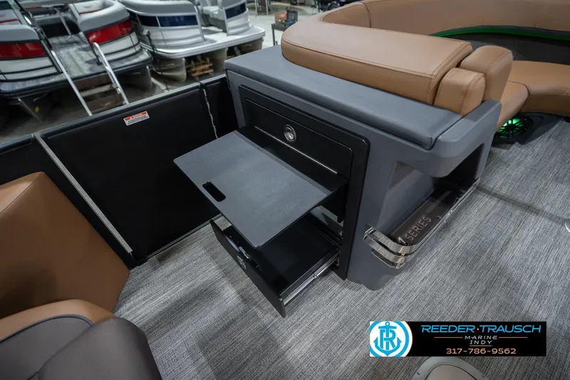 Slide: The Image of 2026 Bennington 22 MFB boat interior with storage compartment and seating. - 32