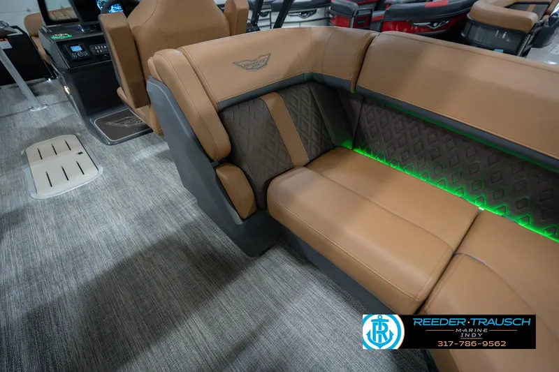 Slide: The Image of Luxurious interior of 2026 Bennington 22 MFB boat with tan seating and ambient lighting. - 33