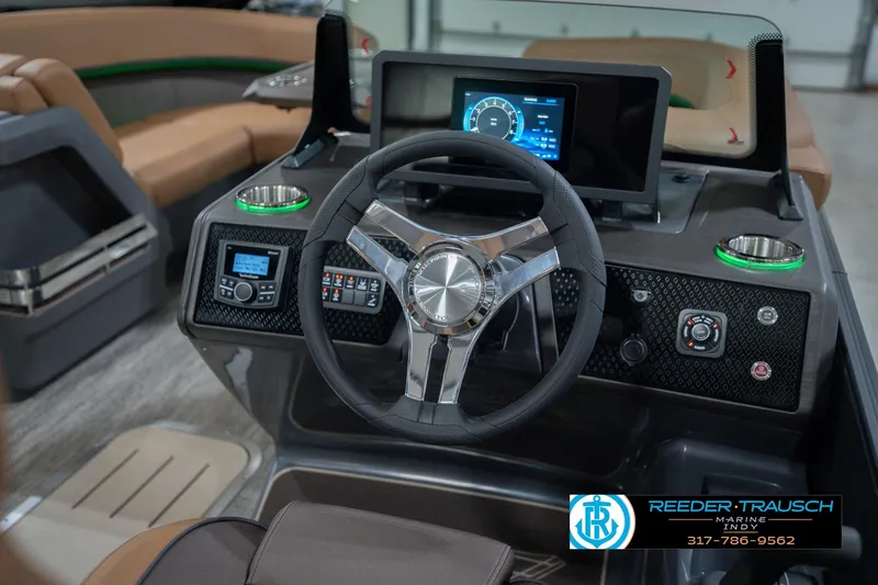 Slide: The Image of 2026 Bennington 22 MFB boat dashboard with steering wheel and digital display. - 36