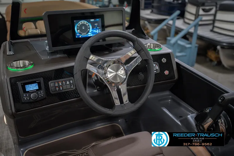 Slide: The Image of Steering console of 2026 Bennington 22 MFB boat with modern controls and display. - 37