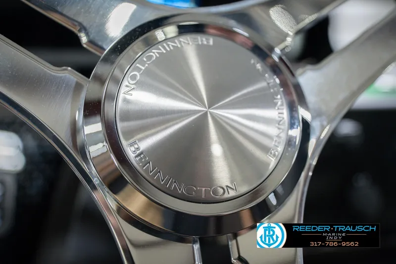 Slide: The Image of Steering wheel of 2026 Bennington 22 MFB boat, featuring sleek metallic design. - 38