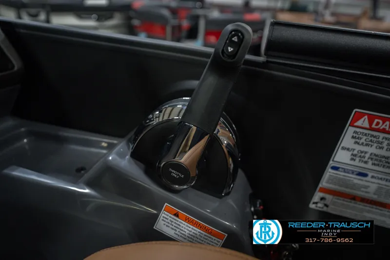 Slide: The Image of Throttle control of 2026 Bennington 22 MFB boat with warning labels and dealer logo. - 43