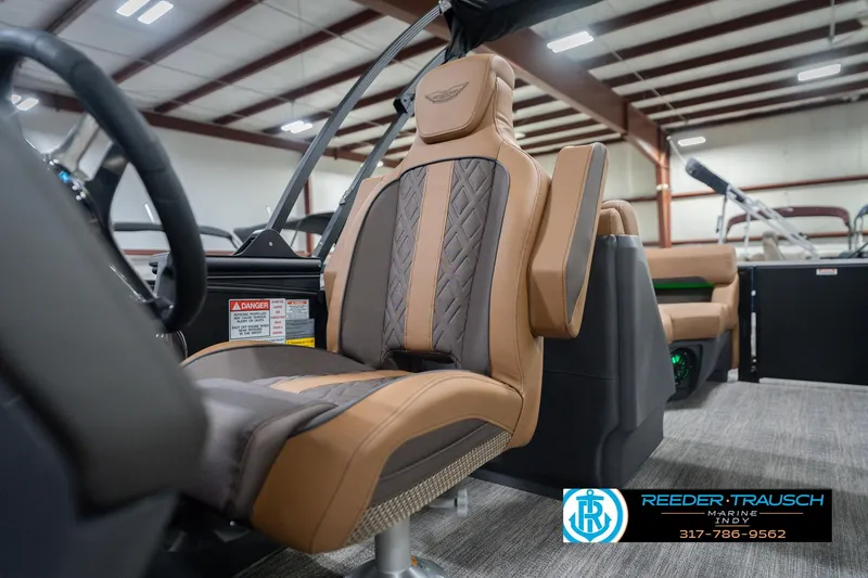 Slide: The Image of Luxurious seating in the 2026 Bennington 22 MFB boat, showcased indoors at Reeder Trausch Marine. - 44