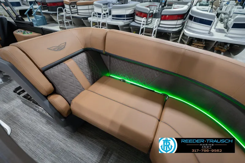 Slide: The Image of Luxurious seating on 2026 Bennington 22 MFB pontoon boat with ambient green lighting. - 47
