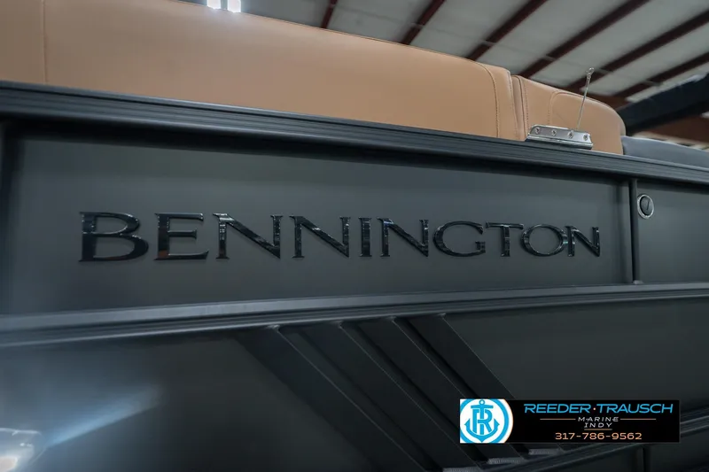 Slide: The Image of 2026 Bennington 22 MFB boat with sleek design and logo detail. - 54