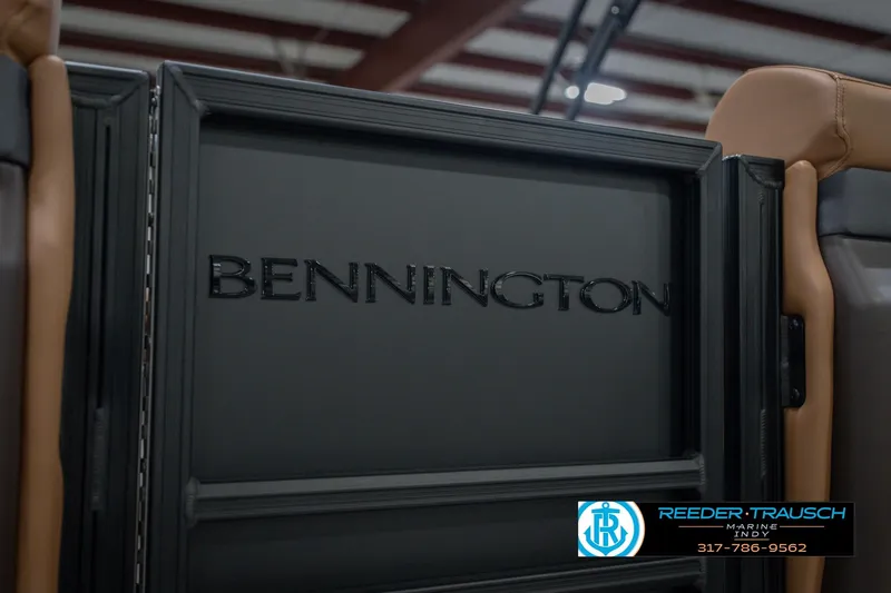Slide: The Image of 2026 Bennington 22 MFB boat interior with logo and dealership contact information. - 56