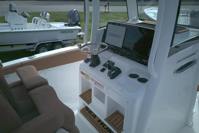 Slide: The Image of 2026 Sea Hunt Ultra 255 SE boat dashboard with Garmin navigation system. - 5