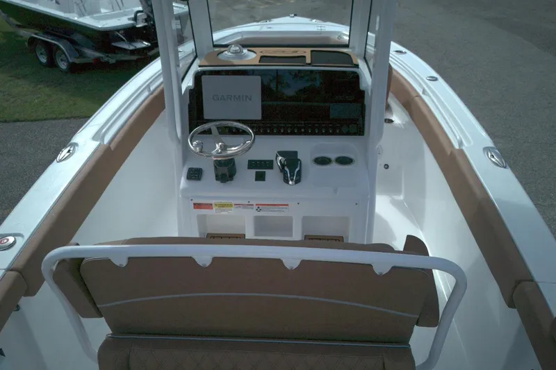 Slide: The Image of 2026 Sea Hunt Ultra 255 SE boat cockpit with Garmin navigation system. - 6