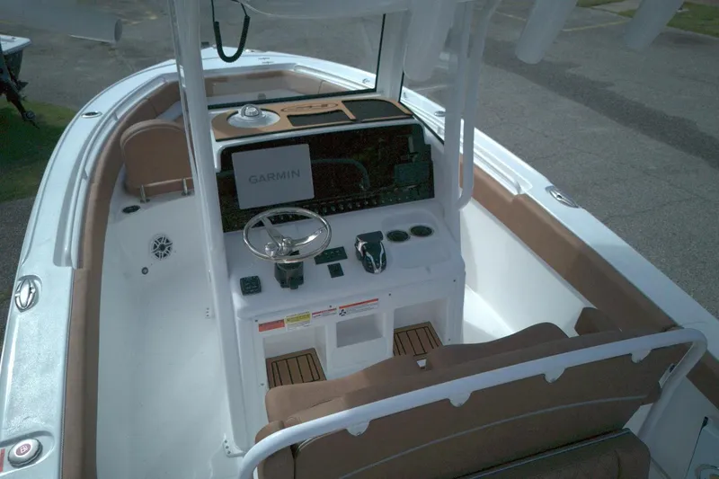 Slide: The Image of 2026 Sea Hunt Ultra 255 SE boat interior with Garmin navigation system. - 7