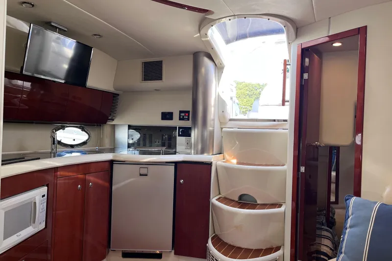 Slide: The Image of Interior of 2006 Fairline Targa 40 yacht with modern kitchen and spiral staircase. - 18
