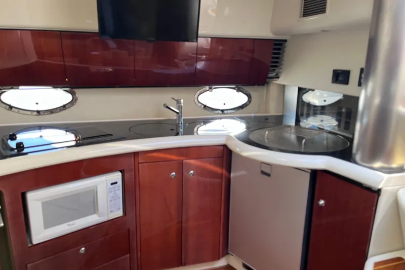 Slide: The Image of Interior of 2006 Fairline Targa 40 yacht kitchen with modern appliances and wood cabinetry. - 20