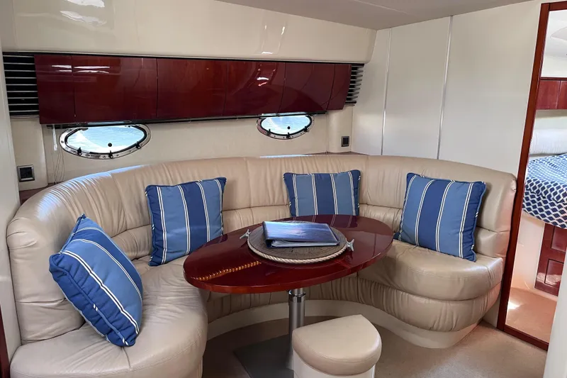 Slide: The Image of Luxurious 2006 Fairline Targa 40 yacht interior with plush seating and blue-striped cushions. - 22