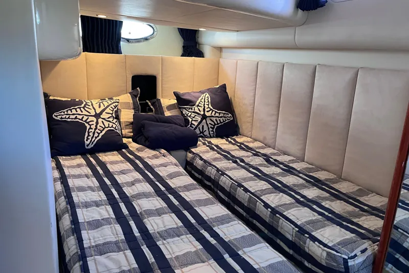 Slide: The Image of Interior of 2006 Fairline Targa 40 yacht with twin beds and nautical decor. - 27